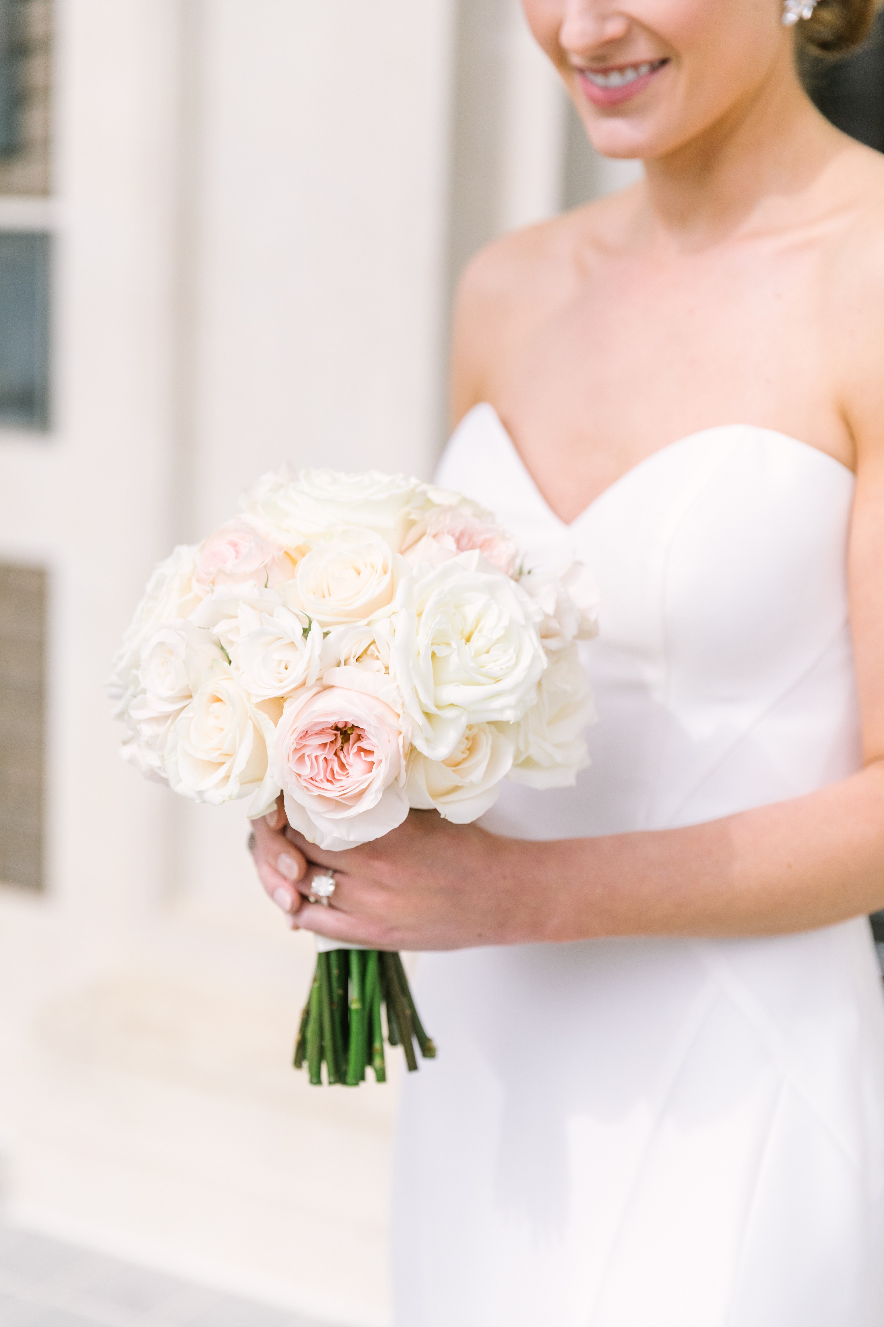 Bride holding her bouquet in Dallas outside of the Scottish Rite Cathedral